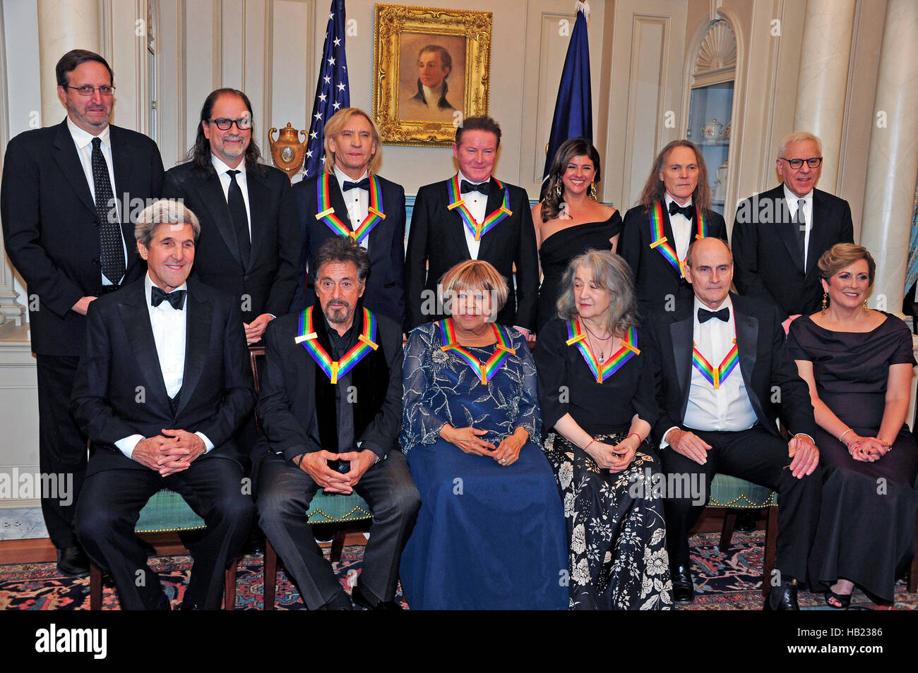 The five recipients of the 39th Annual Kennedy Center Honors pose for a group photo following a dinner hosted by United States Secretary of State John F. Kerry in their honor at the U.S. Department of State in Washington, DC on Saturday, December 3, 2016. The 2016 honorees are: Argentine pianist Martha Argerich; rock band the Eagles; screen and stage actor Al Pacino; gospel and blues singer Mavis Staples; and musician James Taylor. From left to right back row: Ricky Kirshner, Glenn Weiss, Joe Walsh, Don Henley, Cindy Frey, wife of Glenn Frey, who passed away earlier this year, and Timothy B. Stock Photo
