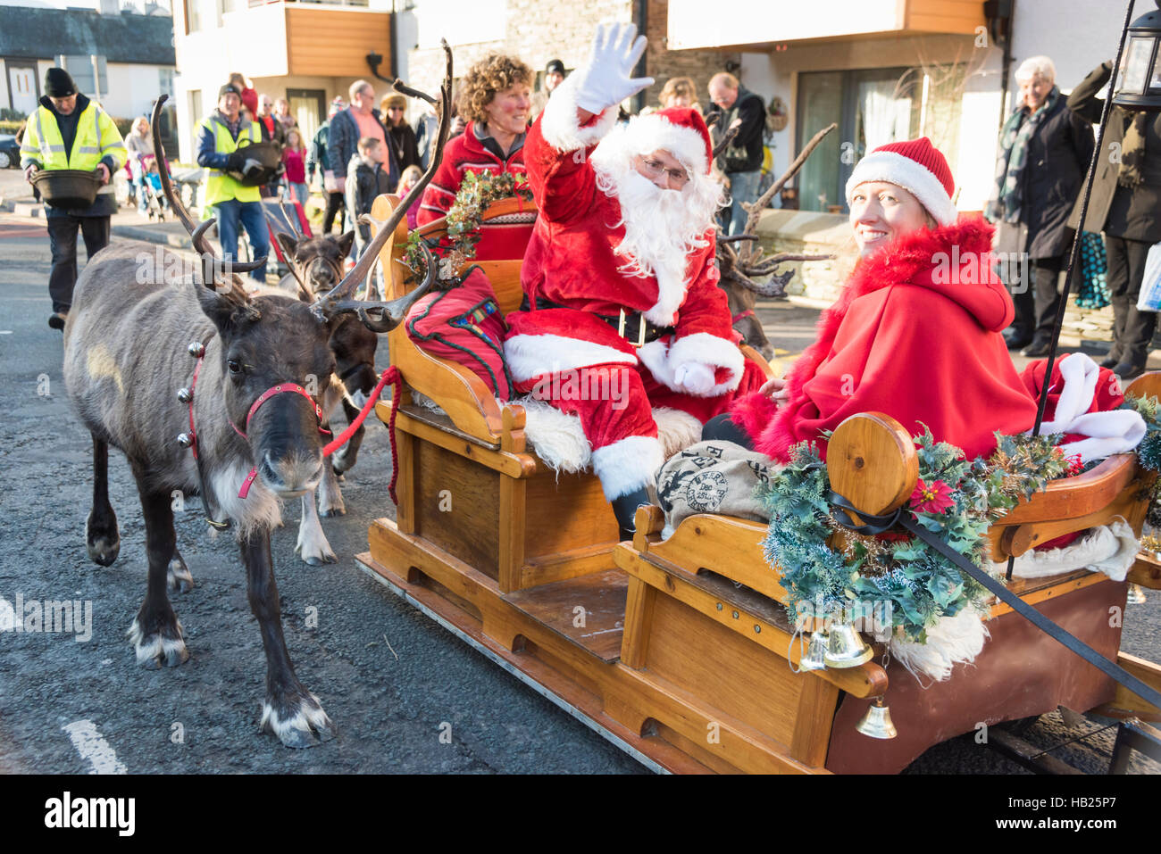 Keswick, Cumbria, UK 4th December 2016. People take part in the Keswick Victorian Christmas Fayre in the Lake District town. The annual event allows charities to promote their causes with Victorian themed stalls and entertainment.  Santa pays a visit accompanied by the Cairngorm Reindeer, the UK’s only free ranging herd. Credit Julian Eales/Alamy Live News Stock Photo