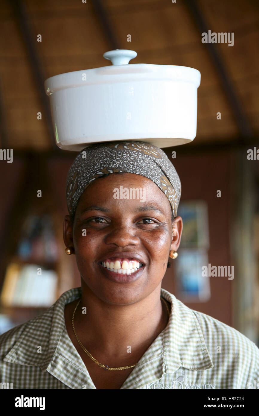 Portrait of black African woman working in high class lodge in Botswana Stock Photo