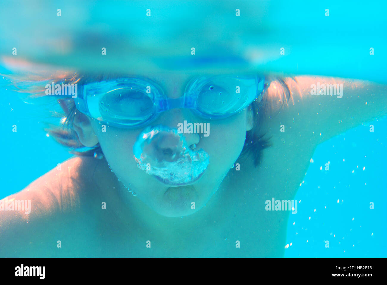 Boy years wearing diving goggles hires stock photography and images