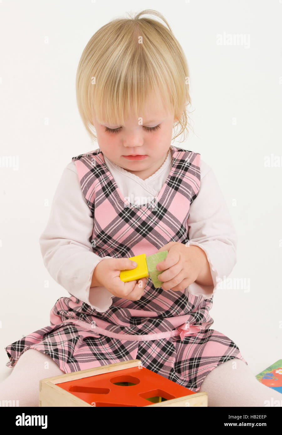 Little girl playing with wooden toys Stock Photo Alamy