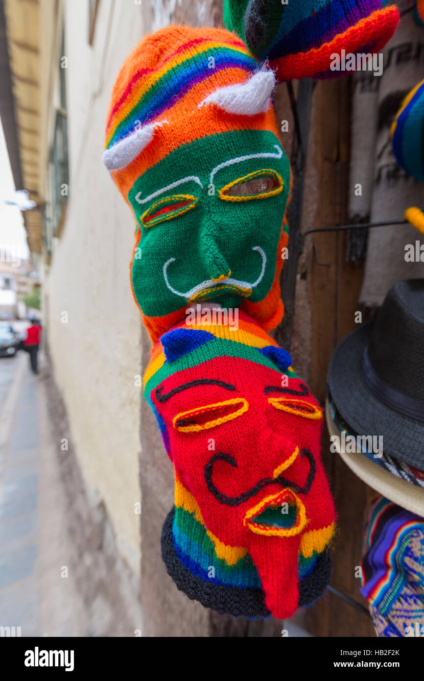 Peruvian colored woolen masks for sale at the tourist craft market in Cusco. Peru Stock Photo