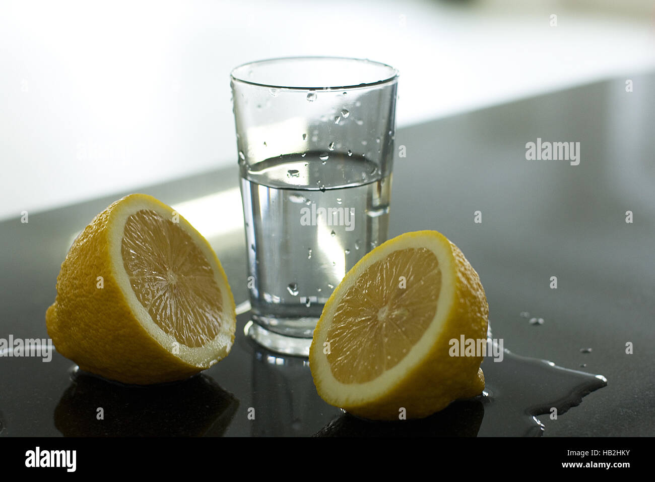 lemon with glas of water Stock Photo