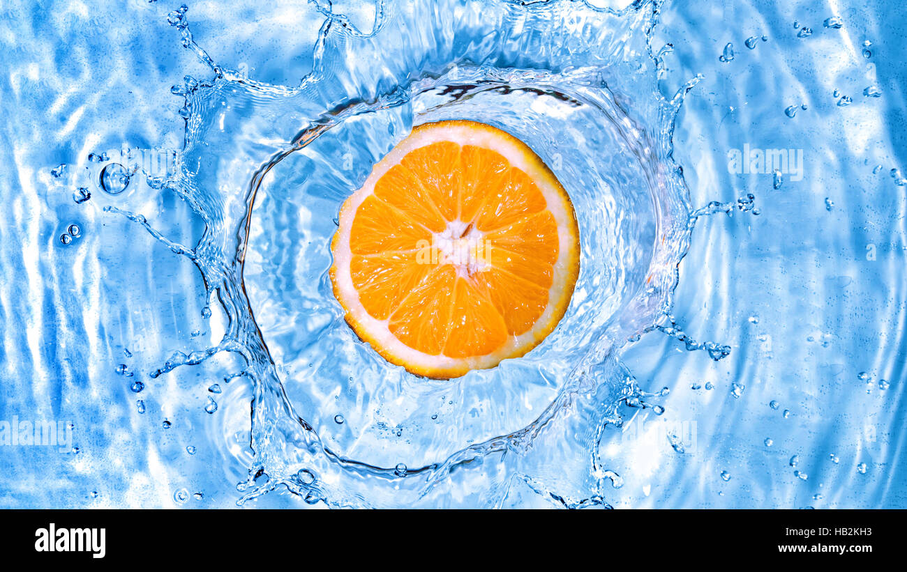 fresh-orange-dropped-into-water-stock-photo-alamy