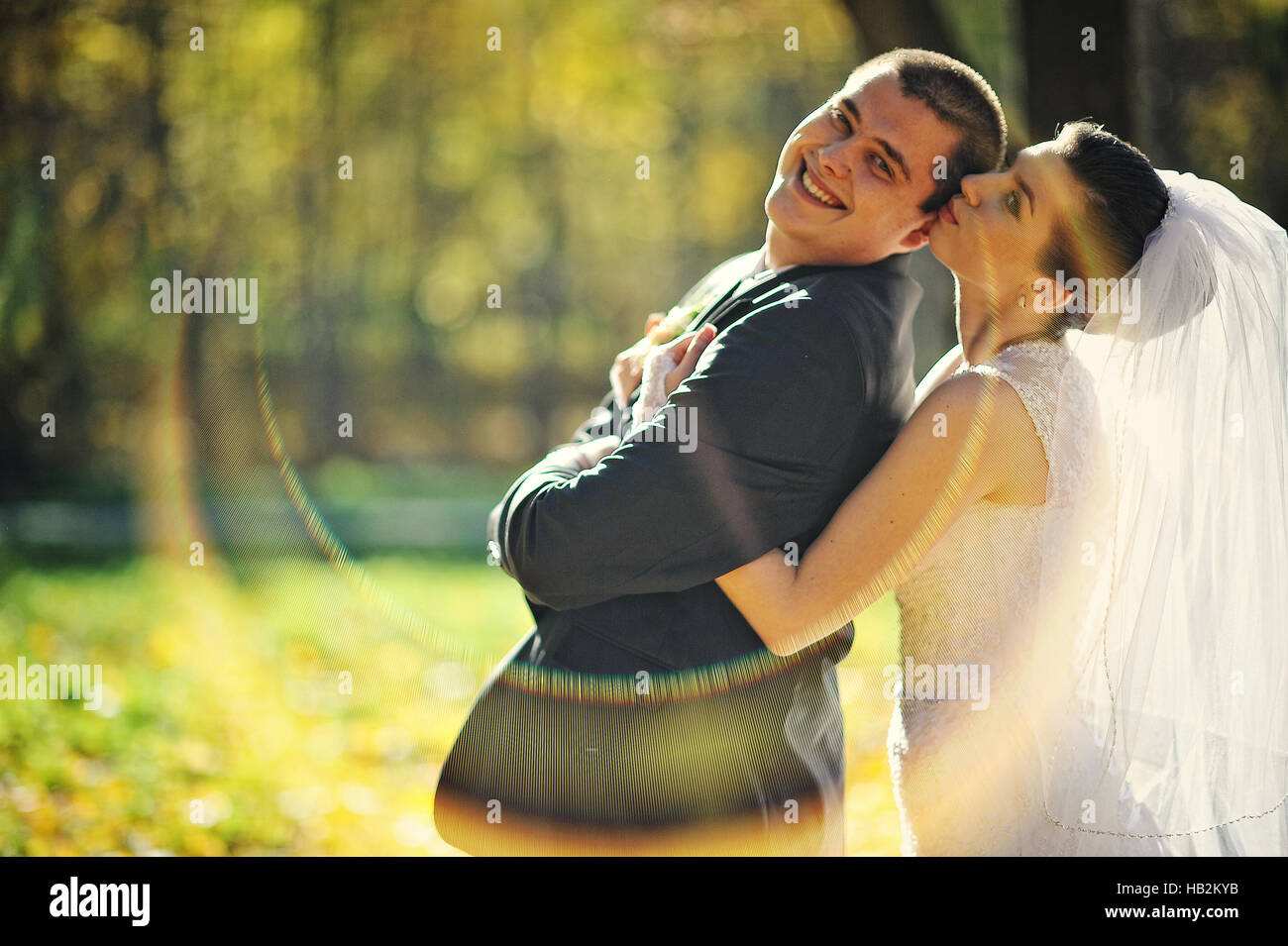 Glorious newlyweds at autumn sunshine Stock Photo