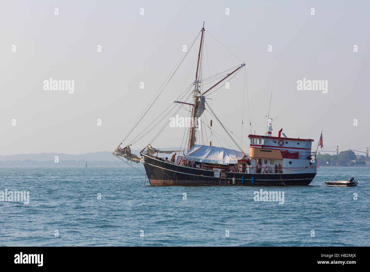 CARTAGENA, COLOMBIA, JANUARY 8: Big passenger sailboat anchored in the bay of Cartagena with clear sky and tourists on board. Colombia 2015 Stock Photo