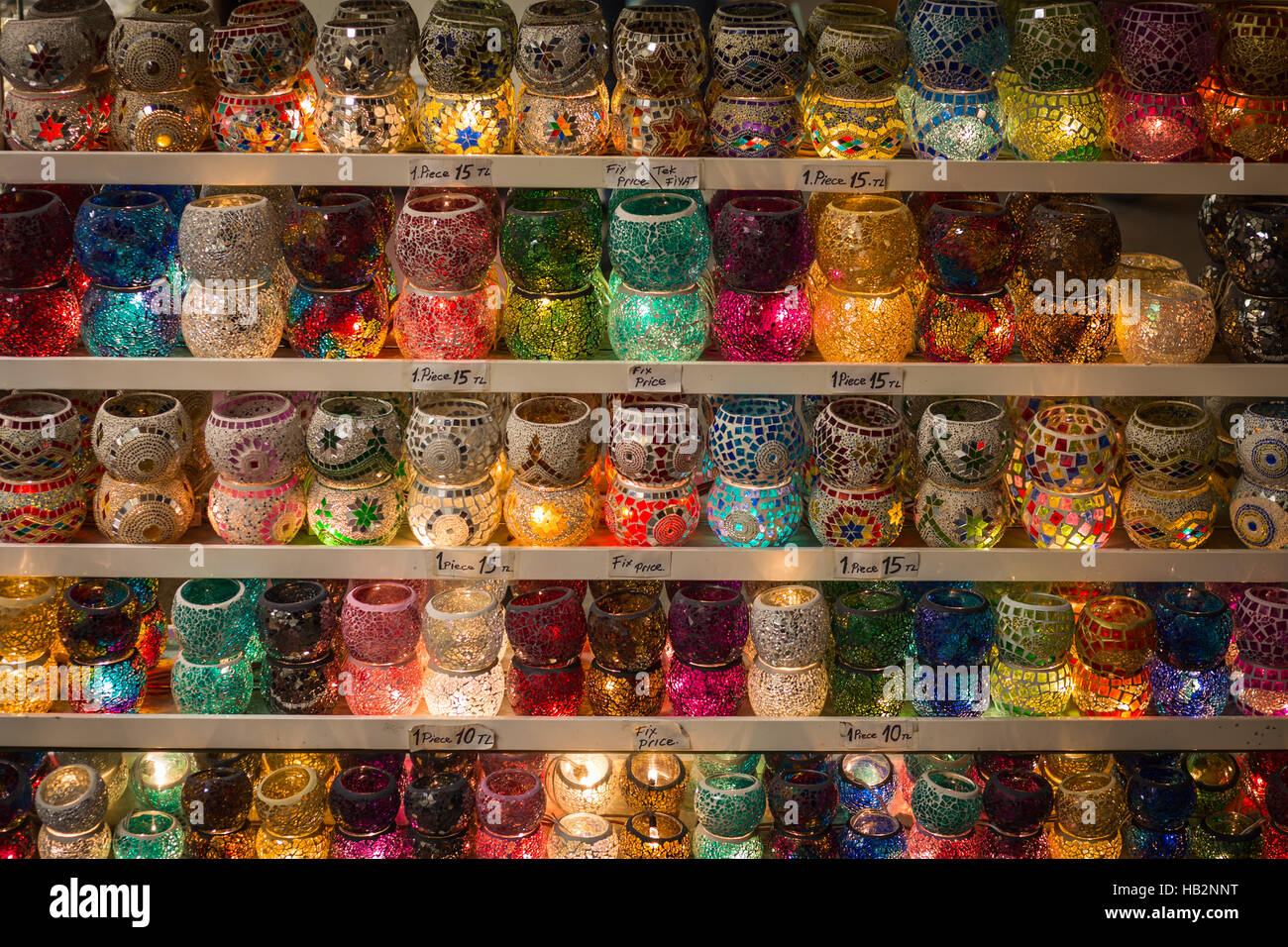 Stand with colorful handmade mosaic glass candle holders sold at Turkey, Istanbul, Grand Bazaar. Stock Photo