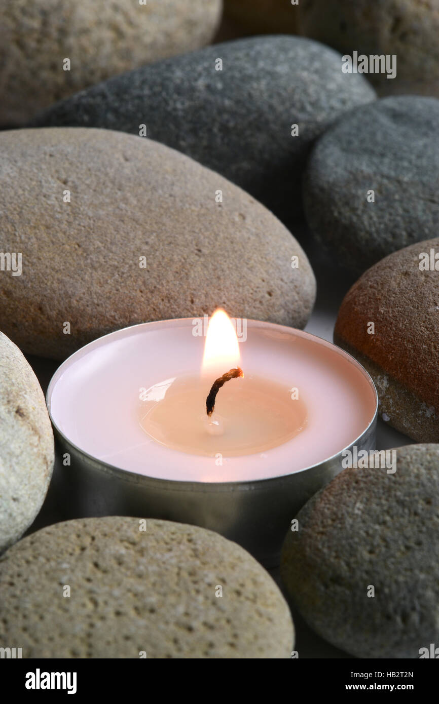 candle inside meditation stones Stock Photo Alamy