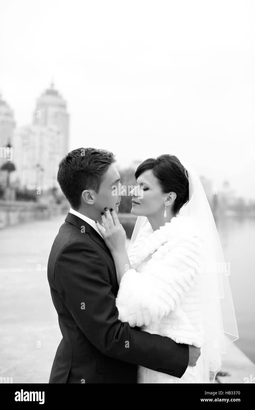 Gentle embrace bride and groom Stock Photo