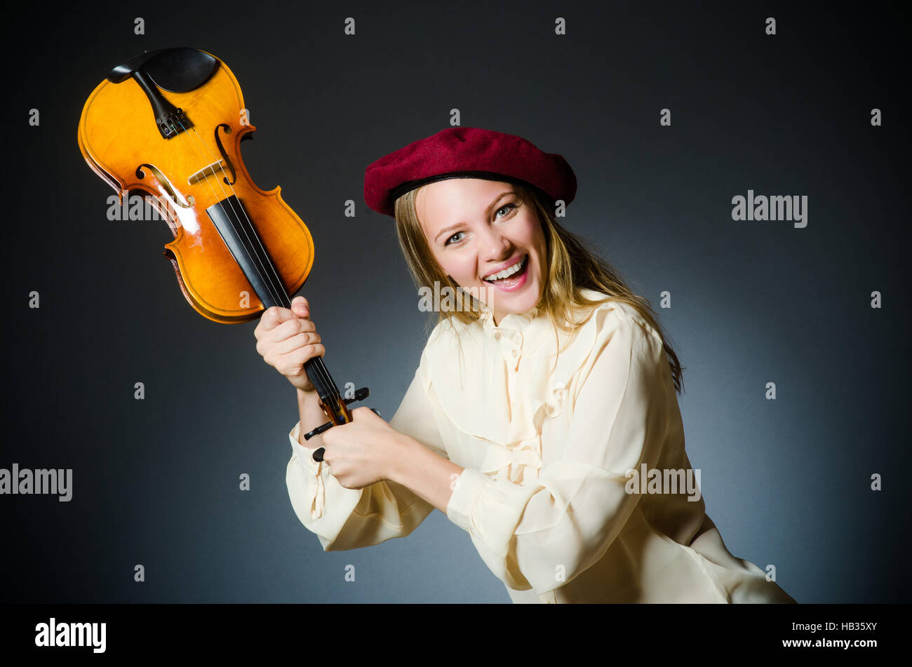Woman violin player in musical concept Stock Photo - Alamy