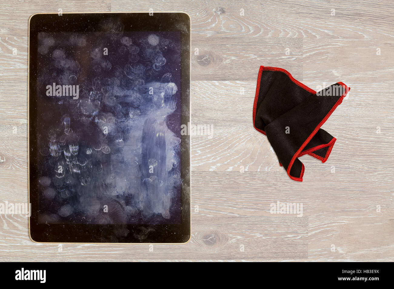 Cloth to wipe fingerprints and grease on tablet screen Stock Photo Alamy