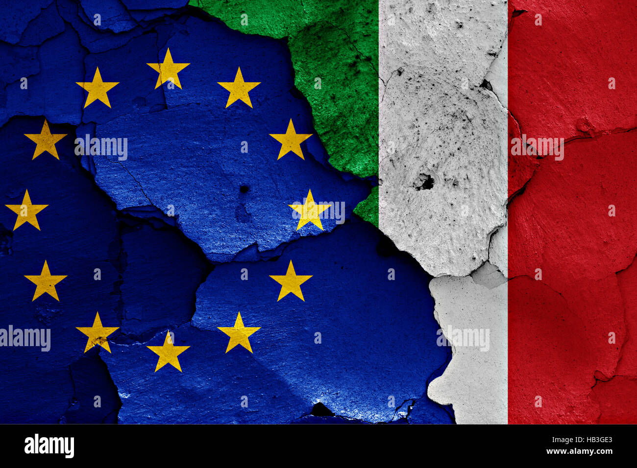 flags of EU and Italy painted on cracked wall Stock Photo