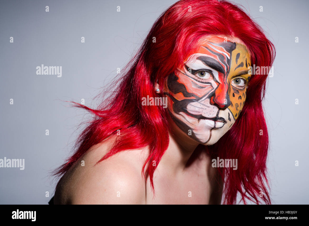 Girl with tiger face painting hi-res stock photography and images - Alamy