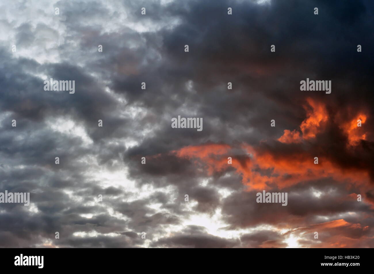 Evening Sky with Dark Fiery Clouds Stock Photo
