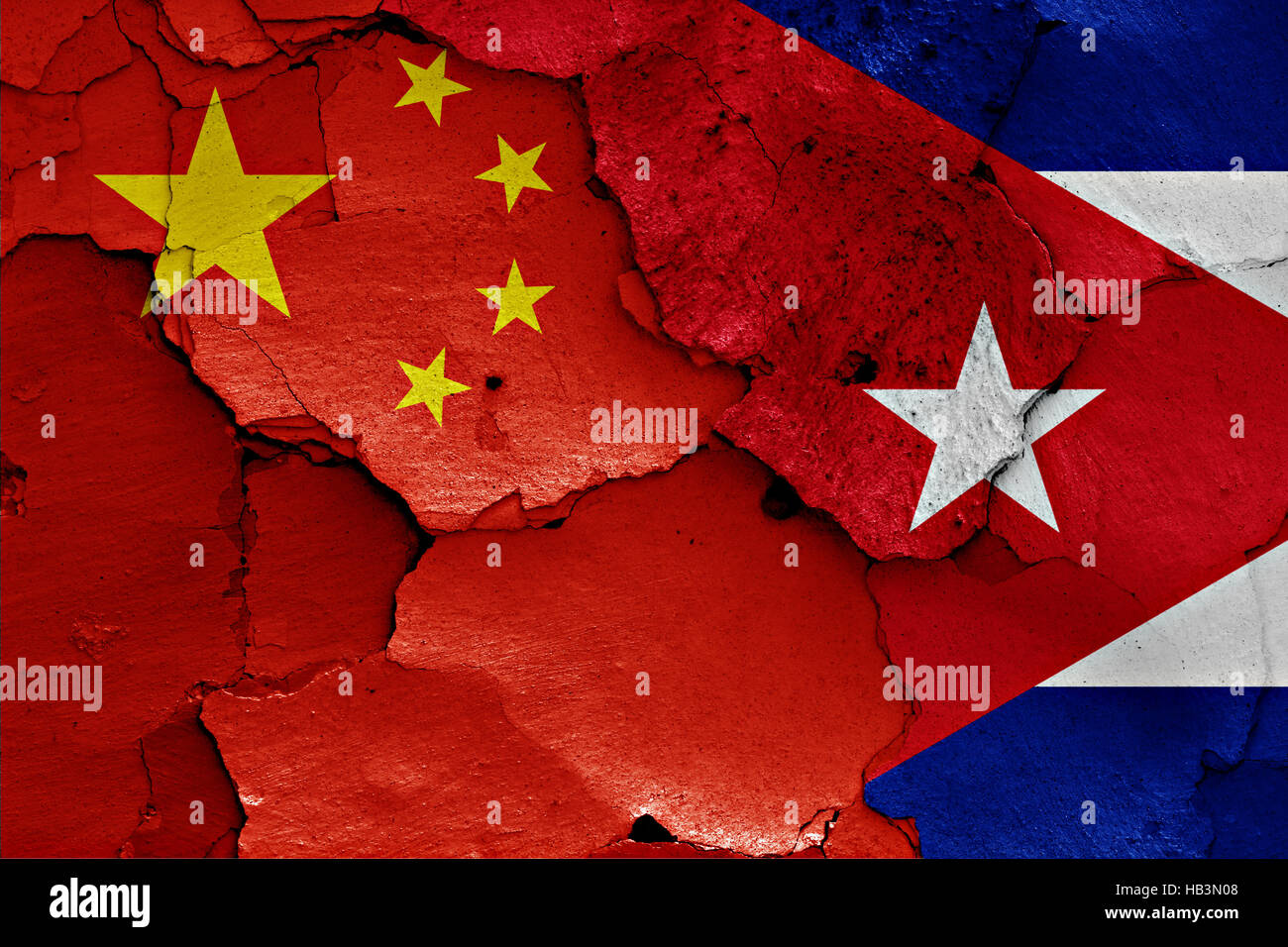 flags of China and Cuba painted on cracked wall Stock Photo