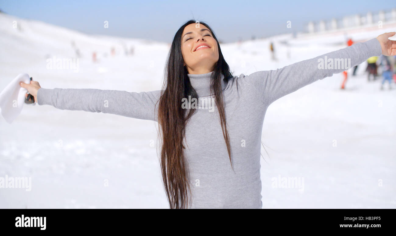 Young woman rejoicing in the winter weather Stock Photo
