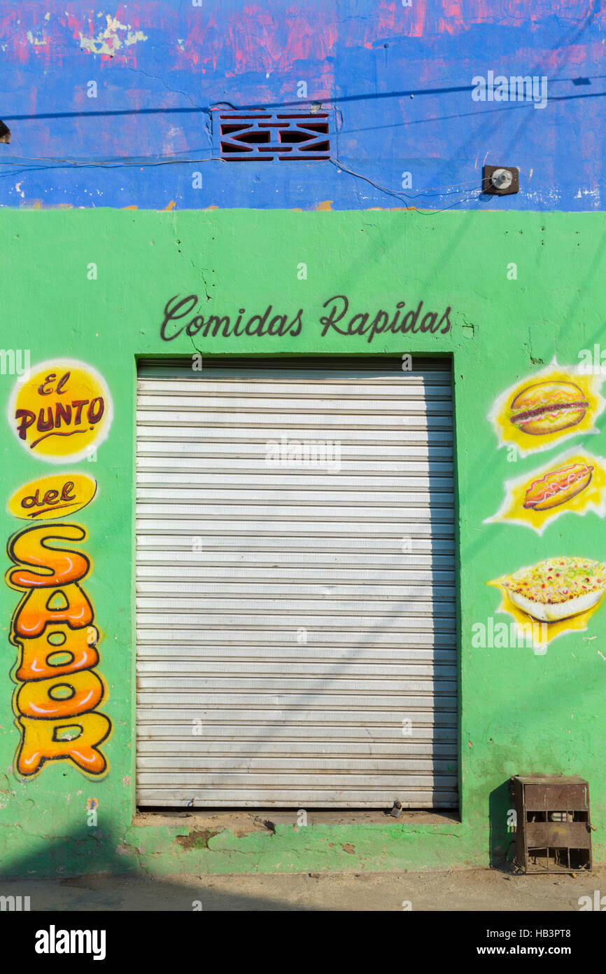 Colorful fastfood restaurant facade in Santa Marta, Colombia Stock Photo