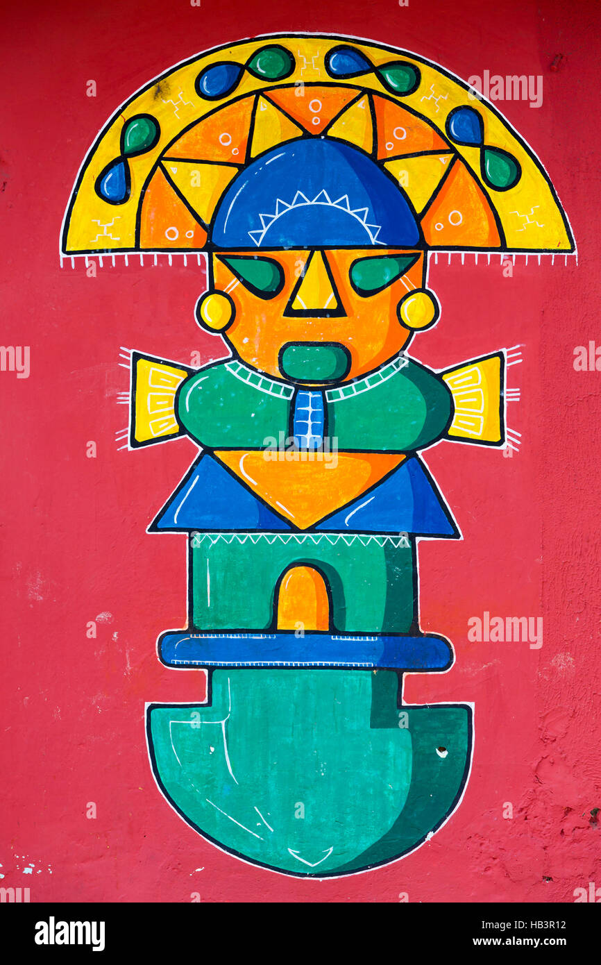 Stylized Maya graffiti on red wall in Banos, Ecuador Stock Photo