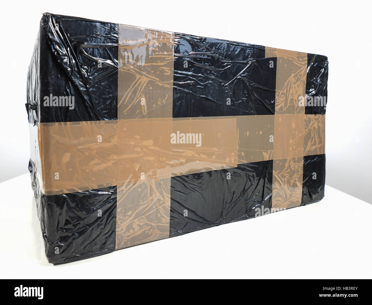 Black packet parcel Stock Photo - Alamy