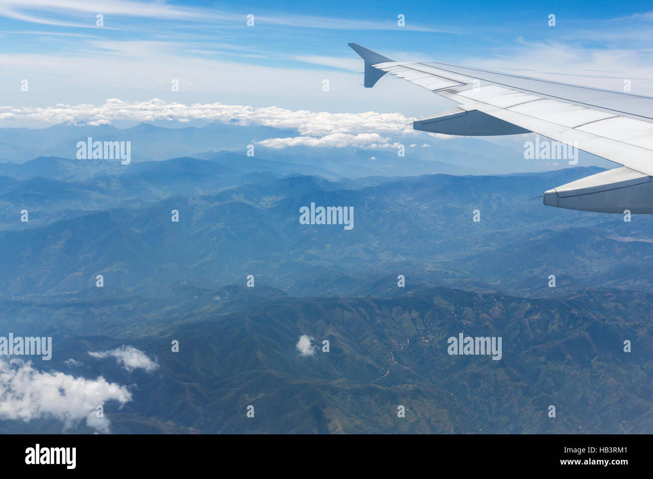 Aerial view of Andean mountains and airplane wing, Colombia Stock Photo