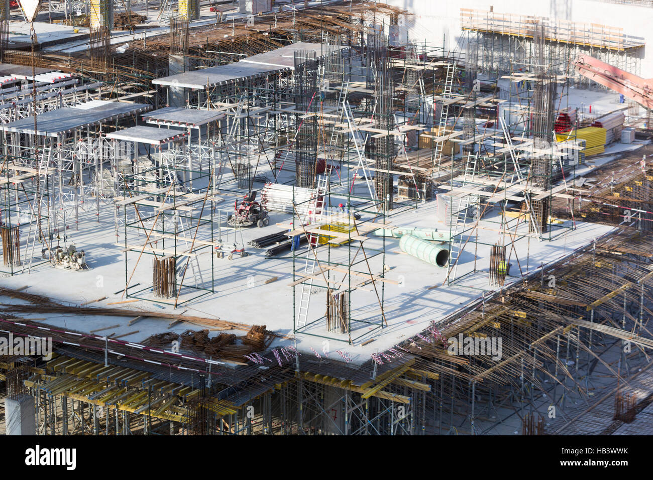 Building construction site with workers in Dubai Stock Photo