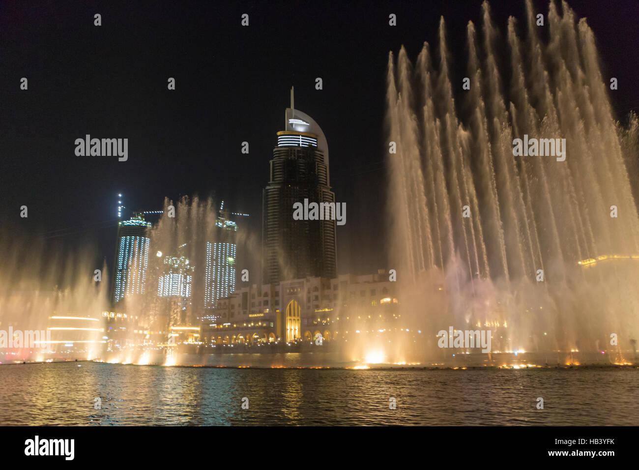 Fountains in action during night show in Dubai downtown Stock Photo