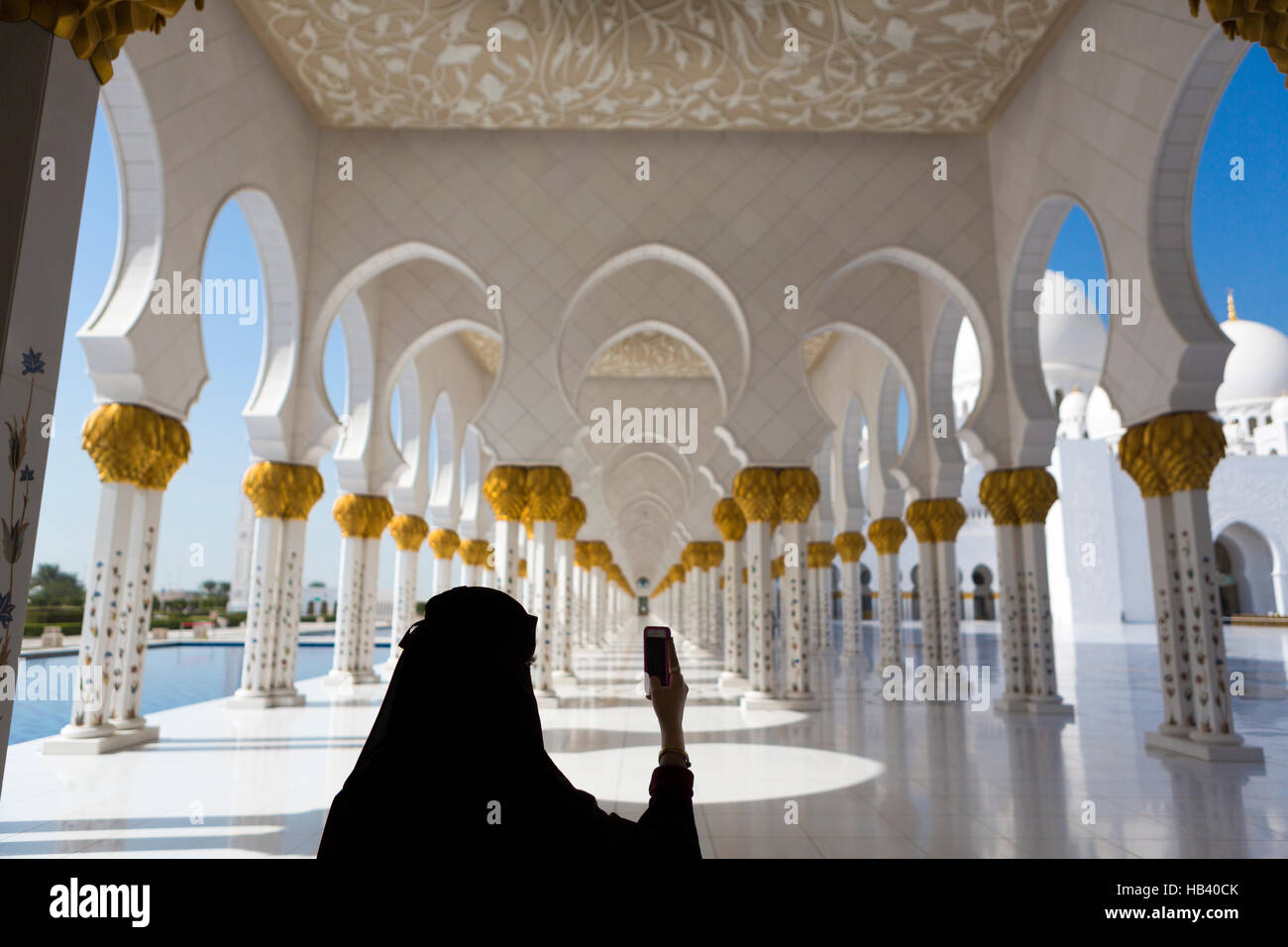 Woman and selfie at Sheikh Zayed Mosque in Abu Dhabi Stock Photo