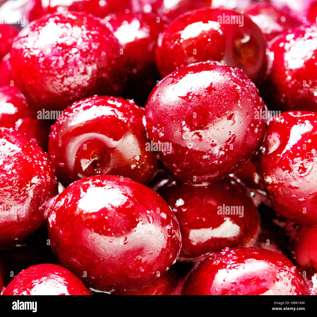Cherries with pits in sugar syrup. Stock Photo