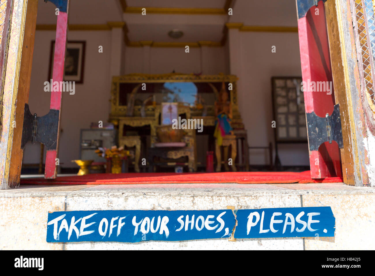 Take off shoes sign before entering in Thai temple in Bangkok, Thailand Stock Photo