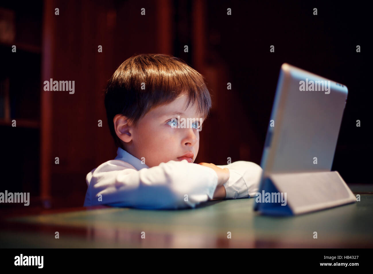 Cute little boy with a tablet pc Stock Photo - Alamy