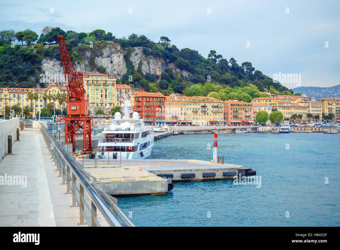 Boats, yachts and crane in the port of Nice Stock Photo