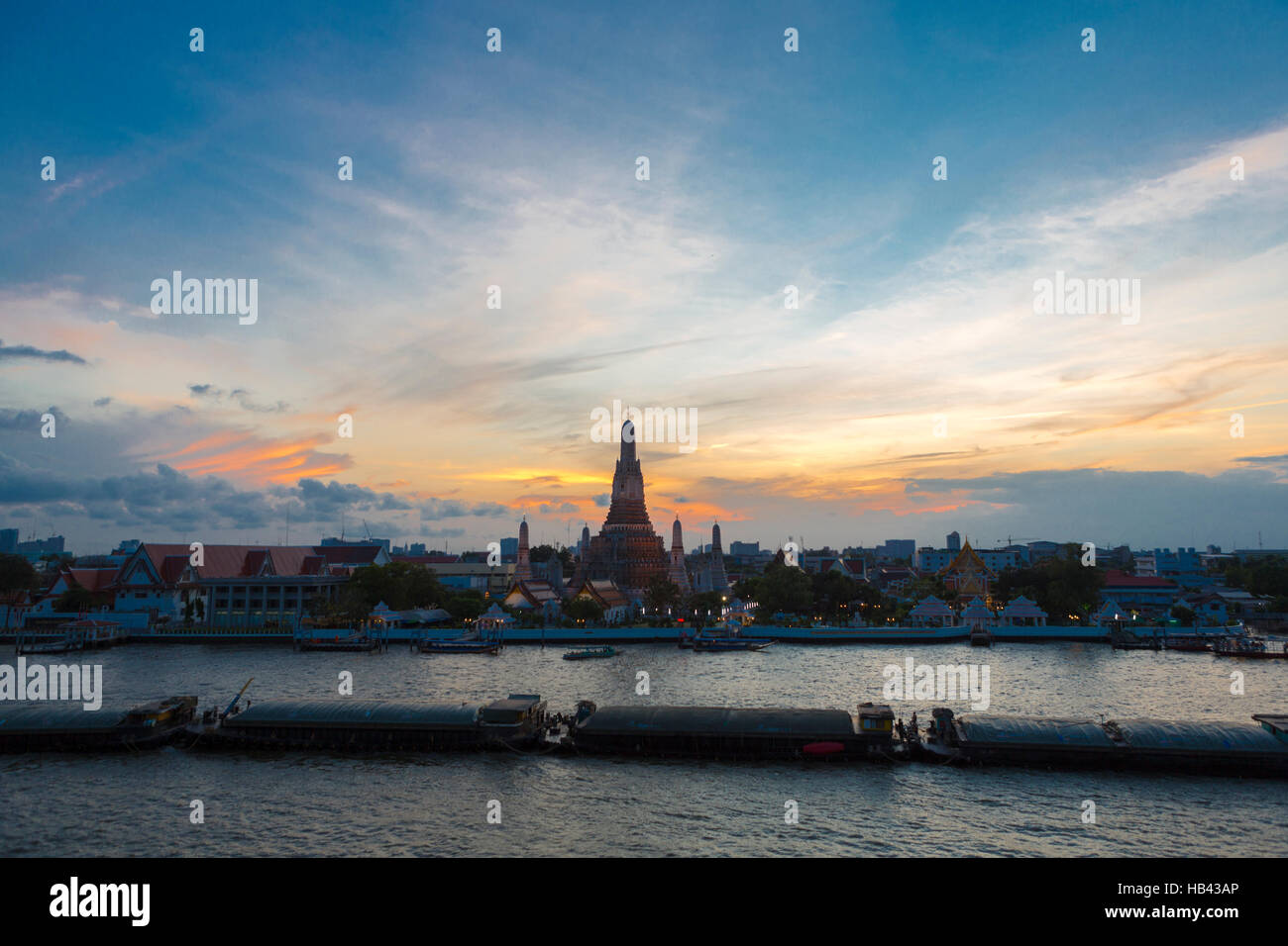 River and Wat Arun Temple during the sunset in Bangkok Thailand Stock ...