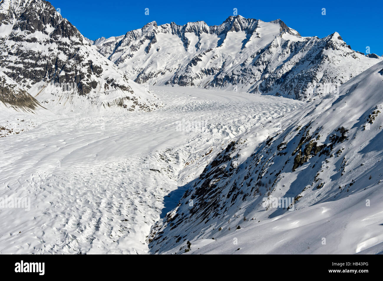 View across the snow-covered Great Aletsch Glacier, Aletsch arena Riederalp, Valais, Switzerland Stock Photo
