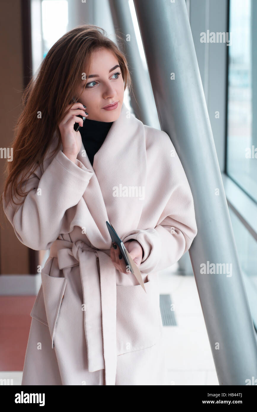Young woman in international airport Stock Photo - Alamy