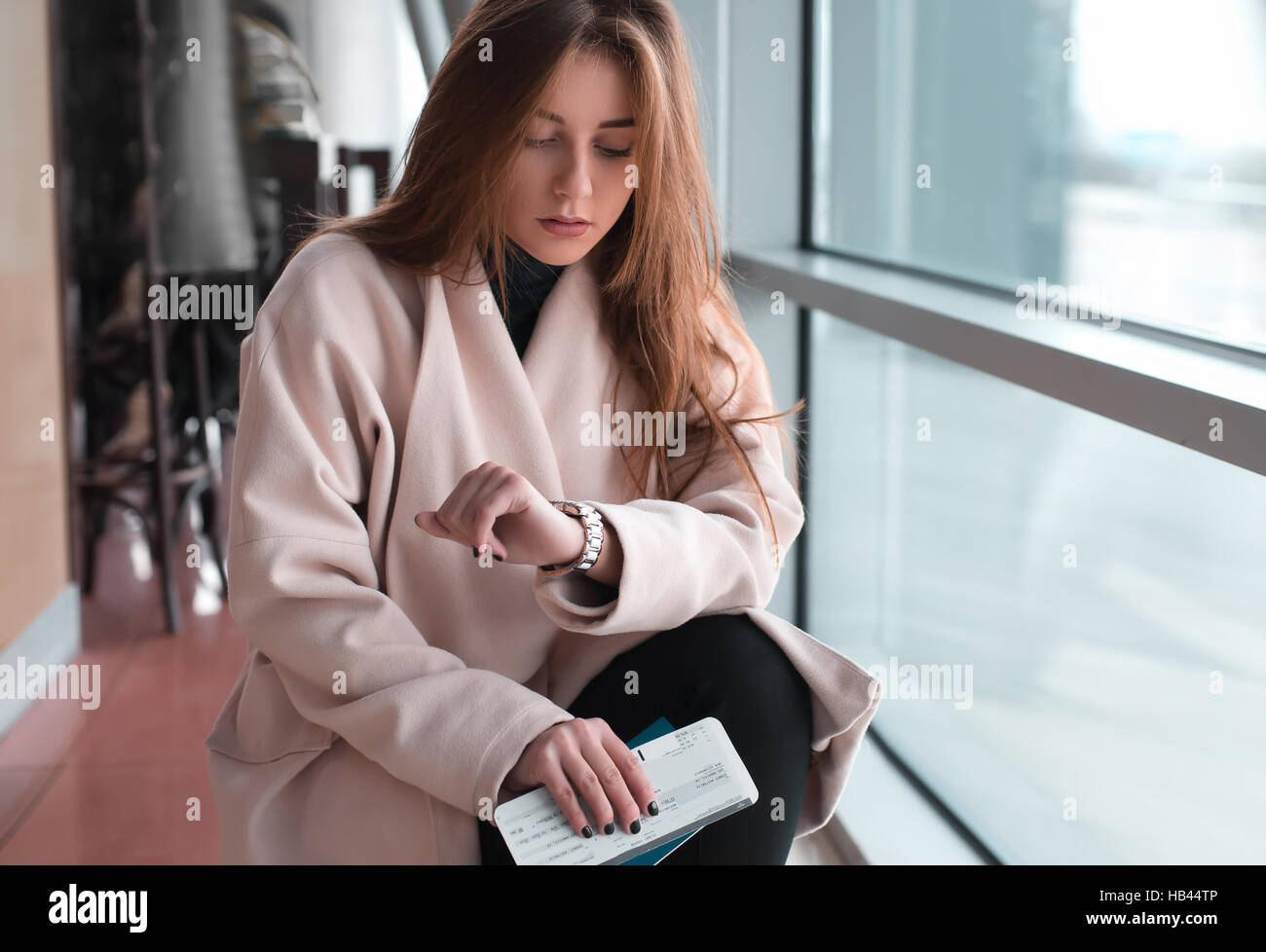 Young woman in international airport Stock Photo - Alamy
