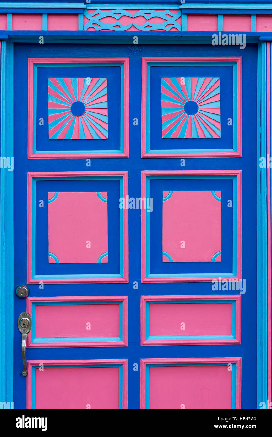 Blue and pink wooden window of a colonial house front in Salento, Colombia Stock Photo