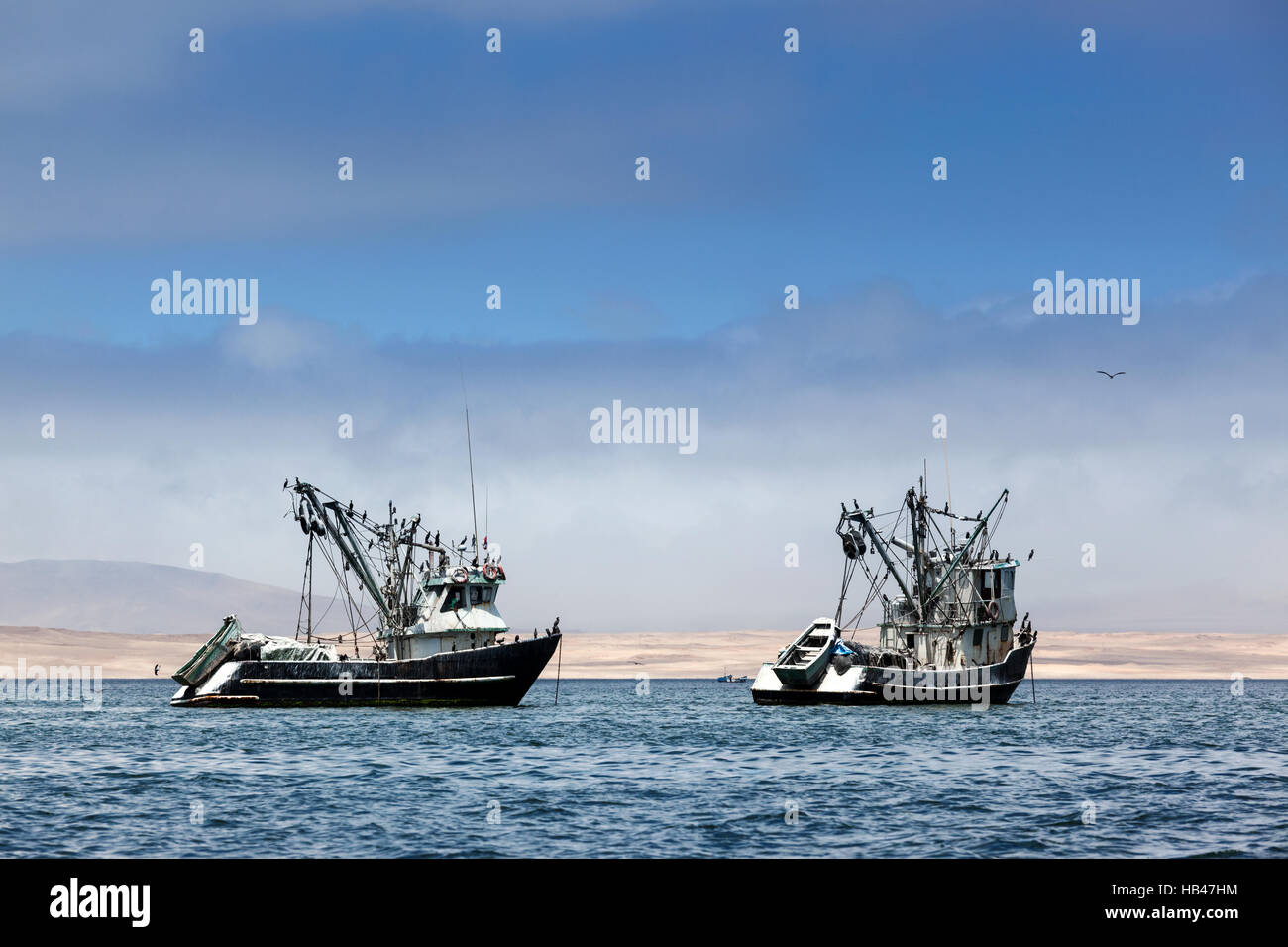 fishing boats in bay Stock Photo - Alamy