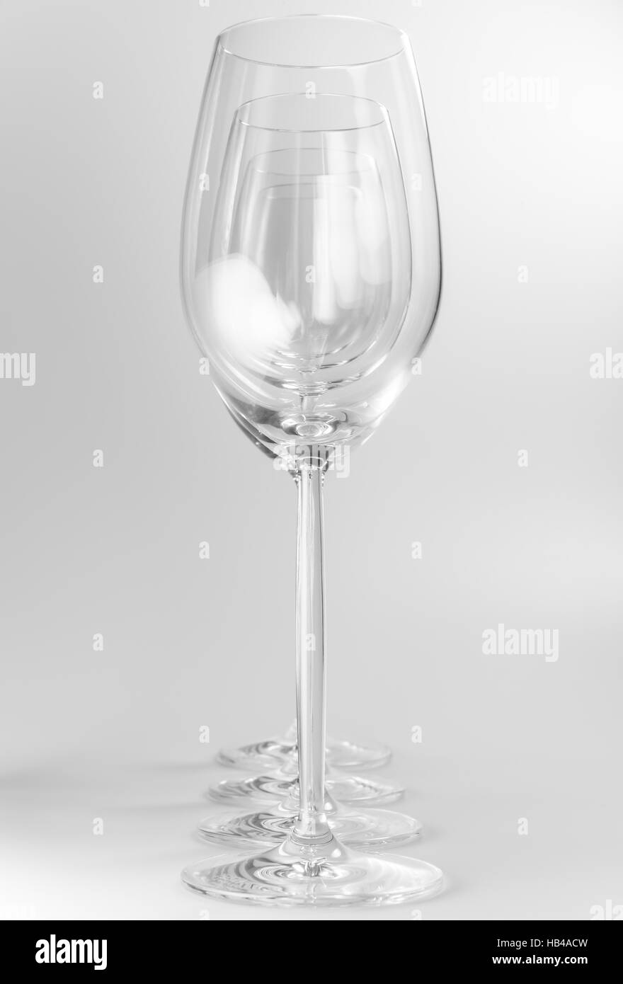 Four crystal wine glasses in a row Stock Photo