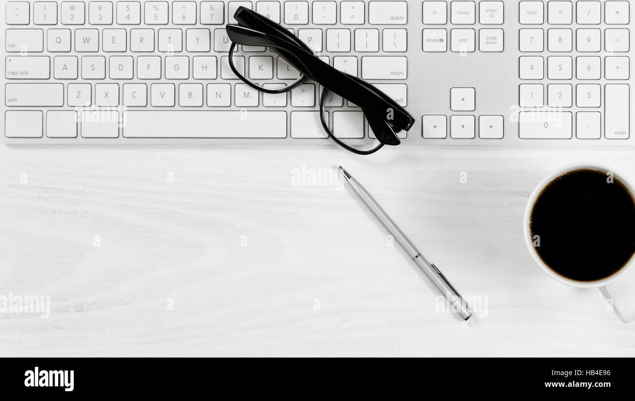 Clean white desktop with basic work items Stock Photo