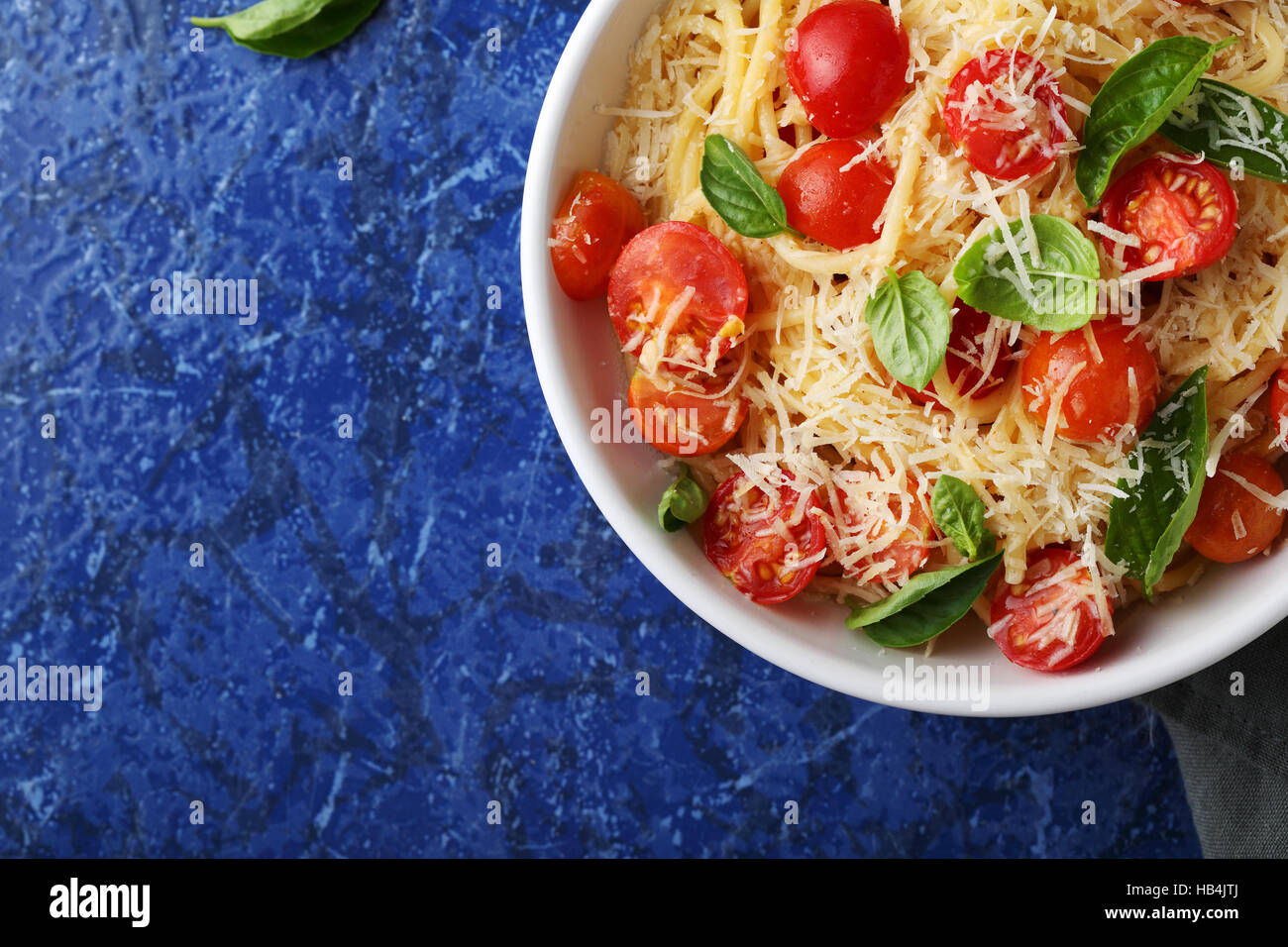 spaghetti with fresh tomato and cheese, food background Stock Photo