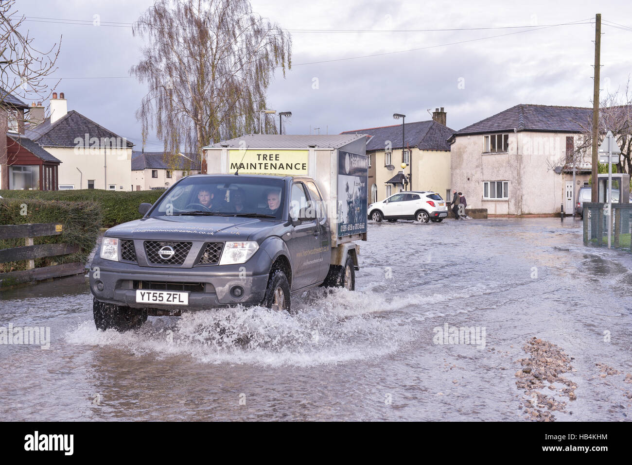 Four-wheel-drive vehicles were the only way to battle through the flood water when the rain stopped after 36 hours in Kendal, Cumbria on the 6th of December 2015. Stock Photo