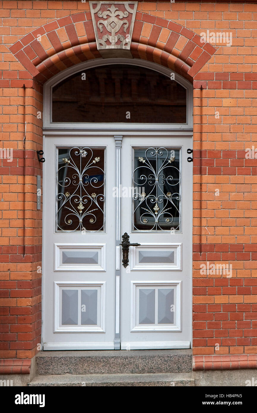 Gray Double Door With Windows In A Red Brick House Stock Photo