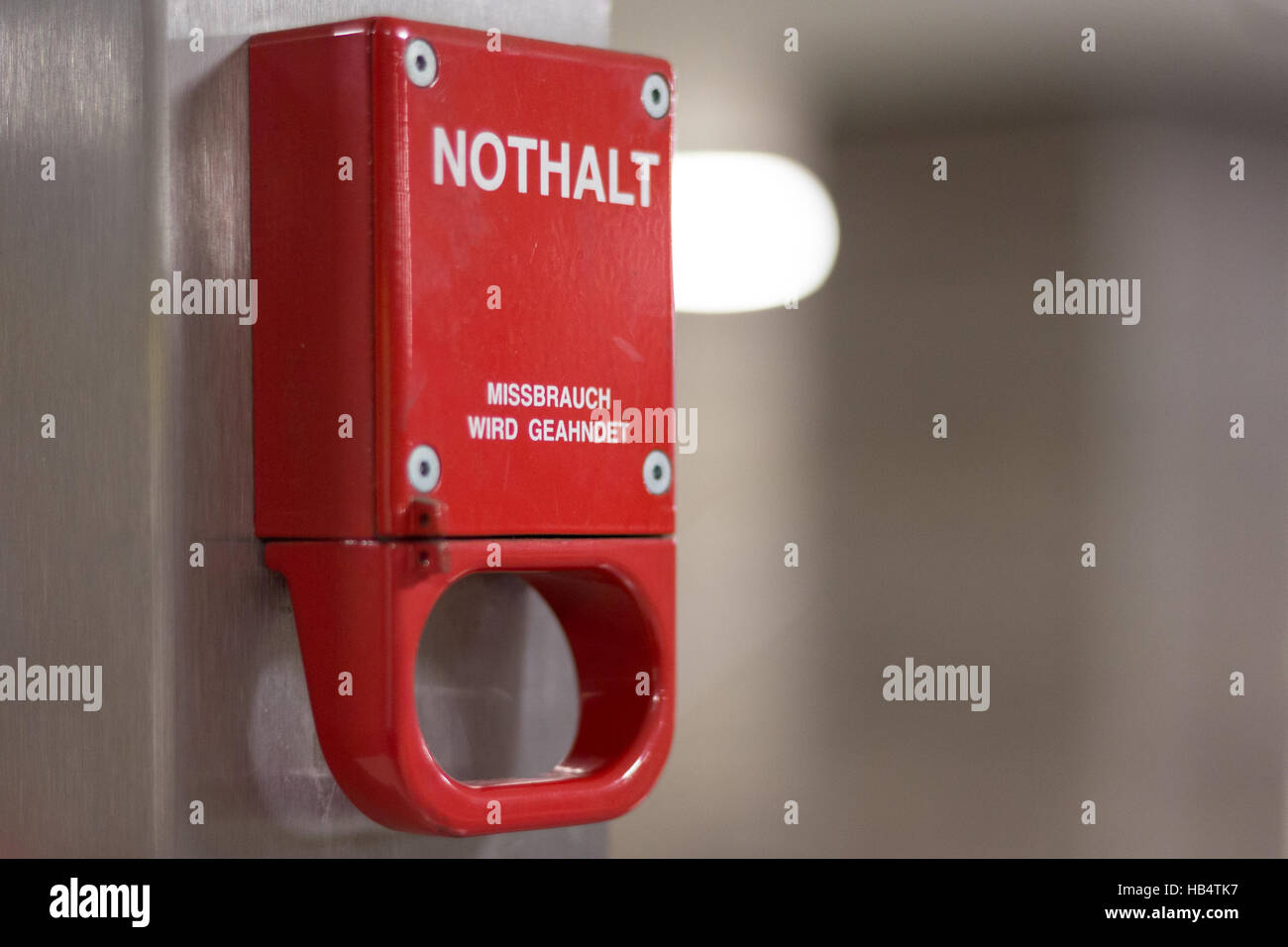 Red emergency brake pull handle Stock Photo Alamy
