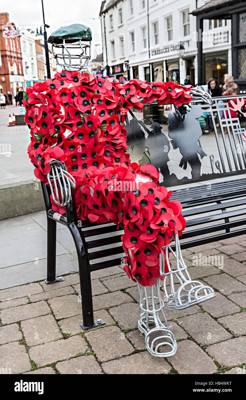 Artwork of man covered in remembrance day poppies, Hereford, England, UK Stock Photo