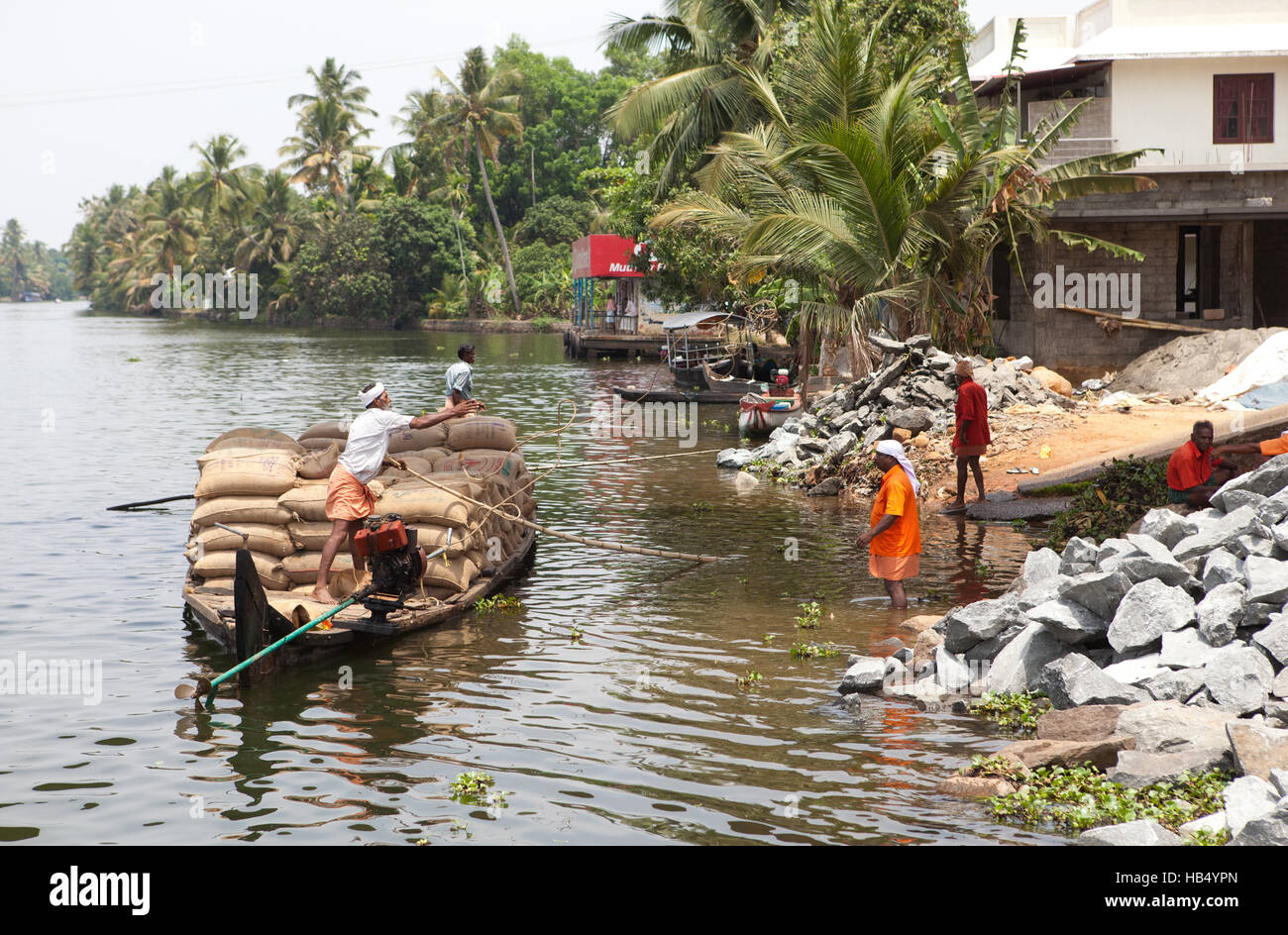 Rice barge landing on shore in Alappuzha (Alleppey), Kerala, India, Stock Photo