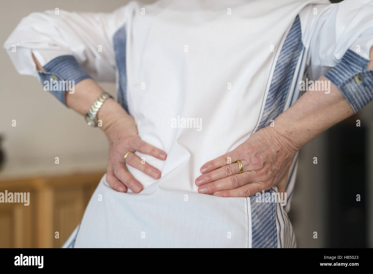 The back supporting a woman's hands. Stock Photo