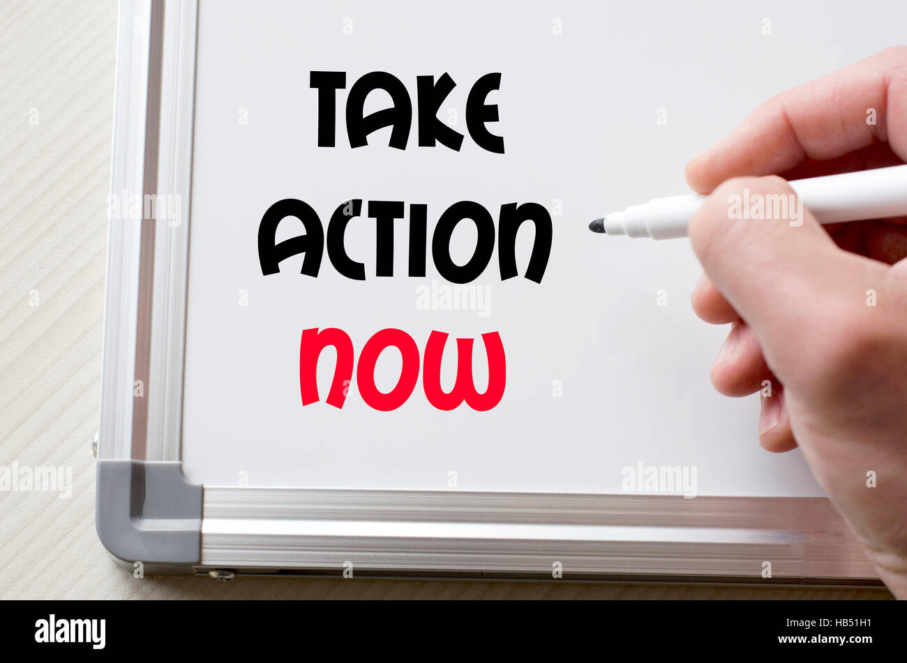 Human hand writing take action now on whiteboard Stock Photo - Alamy