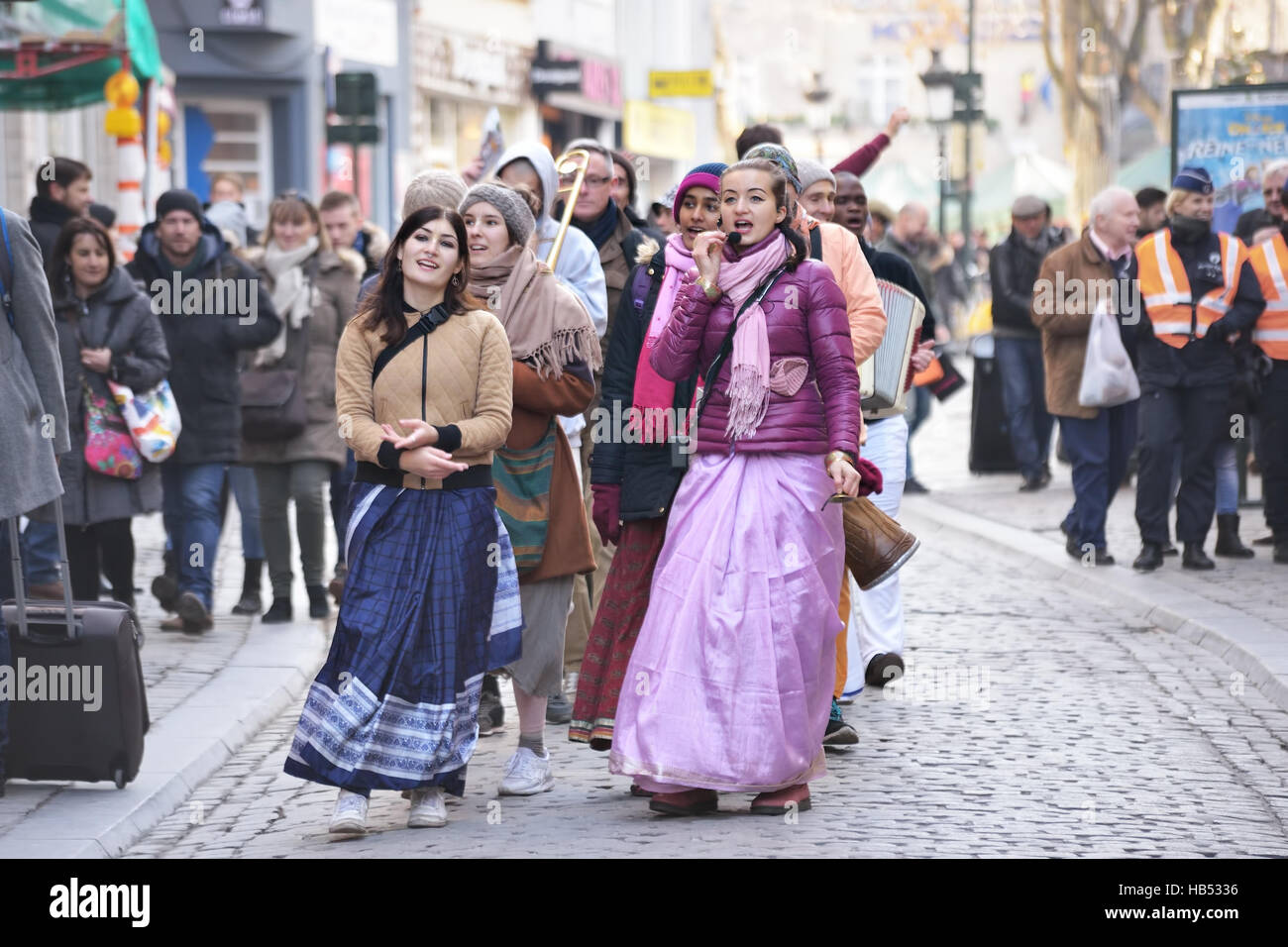 Activists of International Society for Krishna Consciousness sing during procession on the streets in historical center of Brussels, Belgium, on Satur Stock Photo