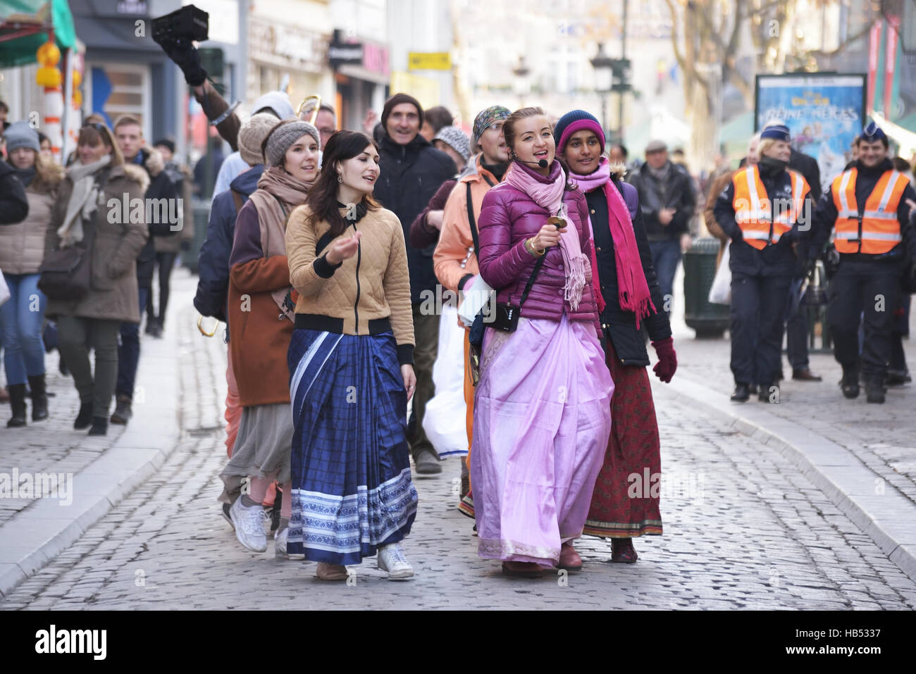 Activists of International Society for Krishna Consciousness sing during procession on the streets in historical center of Brussels, Belgium, on Satur Stock Photo