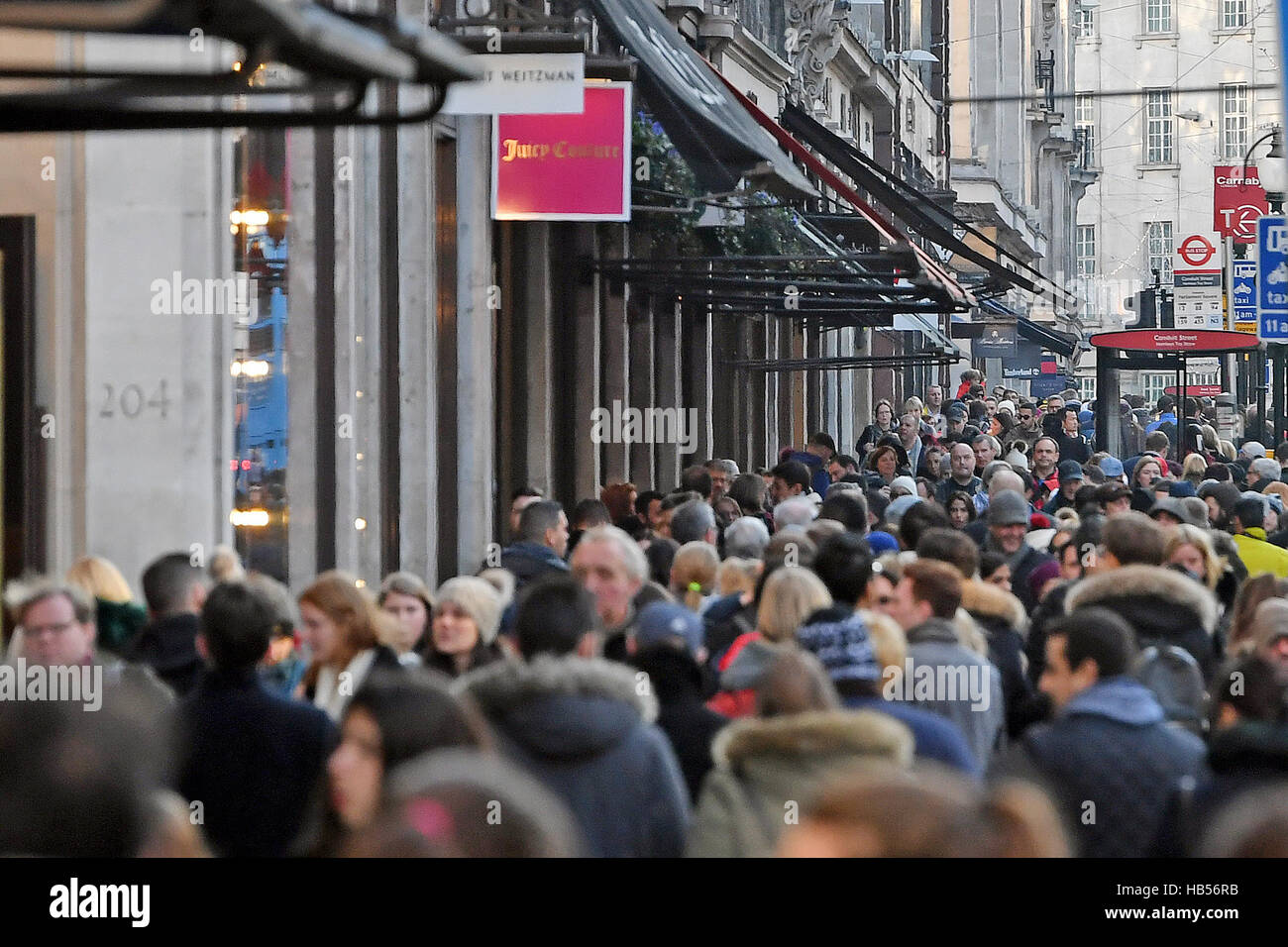 Christmas shoppers fill the pavements on Regents Street in London on the first Sunday in December. Stock Photo